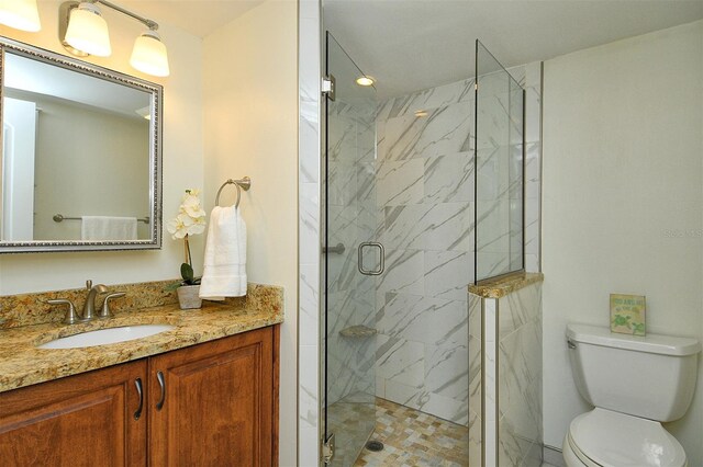3985 Maceachen Blvd Unit 224, Sarasota, FL 34233 - full bathroom featuring vanity and a marble finish shower