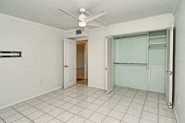 3985 Maceachen Blvd Unit 224, Sarasota, FL 34233 - unfurnished bedroom with crown molding, a closet, and a ceiling fan