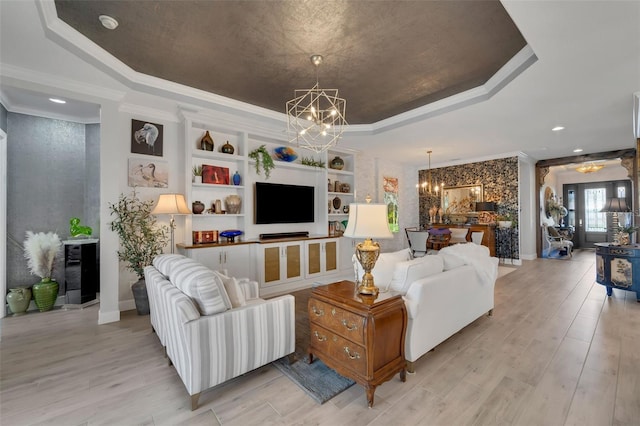 5469 Lampiasi St, Sarasota, FL 34238 - living room with a chandelier, a tray ceiling, crown molding, beverage cooler, and light wood finished floors