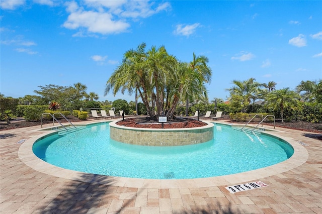 5469 Lampiasi St, Sarasota, FL 34238 - community pool with a patio area
