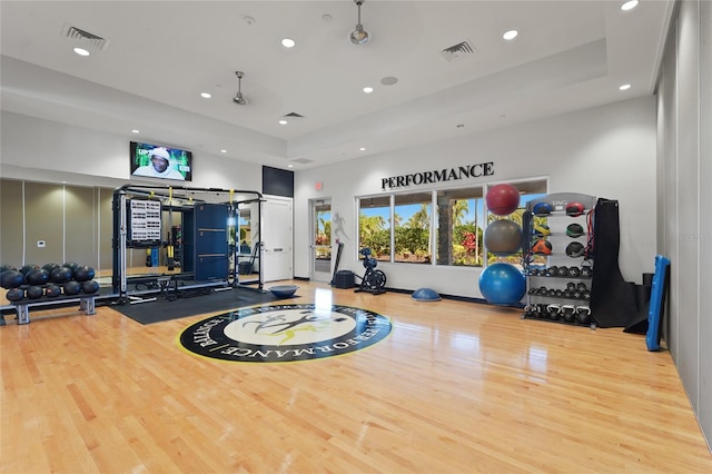 5469 Lampiasi St, Sarasota, FL 34238 - workout area with recessed lighting, wood finished floors, and a raised ceiling