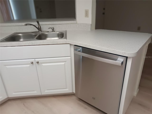4154 Center Pointe Cir Unit 57A, Sarasota, FL 34233 - kitchen featuring dishwasher, white cabinets, and light countertops