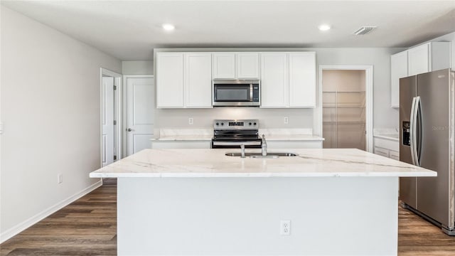 3227 Bitterroot Ln, Lakewood Ranch, FL 34211 - kitchen featuring stainless steel appliances, dark wood finished floors, light stone counters, and recessed lighting