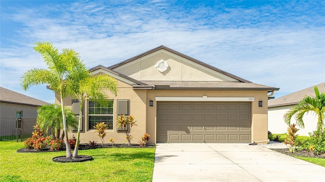 5327 Olano St, Palmetto, FL 34221 - ranch-style home with stucco siding, an attached garage, and driveway