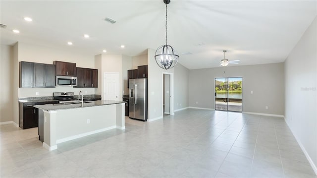 5327 Olano St, Palmetto, FL 34221 - kitchen with appliances with stainless steel finishes, open floor plan, an island with sink, ceiling fan, and a chandelier