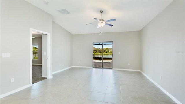 5327 Olano St, Palmetto, FL 34221 - empty room featuring ceiling fan, light tile patterned floors, and vaulted ceiling