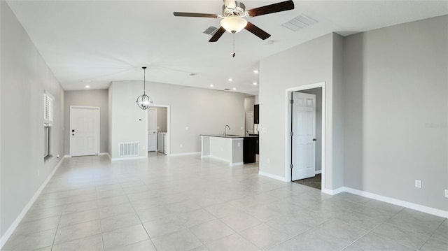 5327 Olano St, Palmetto, FL 34221 - unfurnished living room with a ceiling fan, light tile patterned floors, vaulted ceiling, and recessed lighting