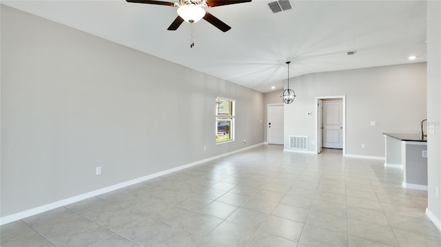 5327 Olano St, Palmetto, FL 34221 - unfurnished living room with a ceiling fan, recessed lighting, light tile patterned flooring, and vaulted ceiling