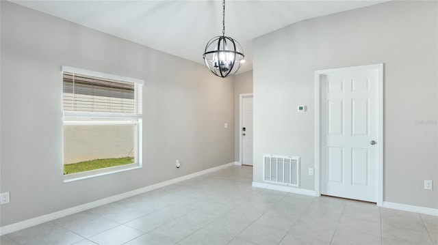 5327 Olano St, Palmetto, FL 34221 - empty room featuring a chandelier and light tile patterned floors
