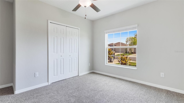 5327 Olano St, Palmetto, FL 34221 - unfurnished bedroom with carpet floors, a closet, and a ceiling fan