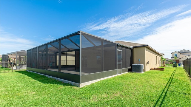 5327 Olano St, Palmetto, FL 34221 - rear view of house with a fenced backyard and glass enclosure