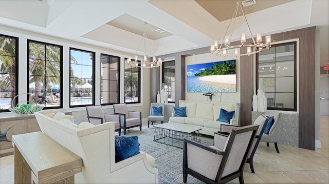 5327 Olano St, Palmetto, FL 34221 - living area featuring a chandelier, plenty of natural light, a tray ceiling, and light tile patterned floors