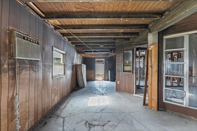 268 Alsace Ave, Venice, FL 34293 - hallway with wood walls and an AC wall unit
