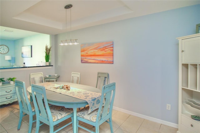 4026 Overture Cir Unit 487, Bradenton, FL 34209 - dining room with a raised ceiling and light tile patterned floors