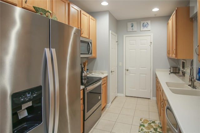 4026 Overture Cir Unit 487, Bradenton, FL 34209 - kitchen featuring appliances with stainless steel finishes, recessed lighting, light tile patterned floors, and light countertops