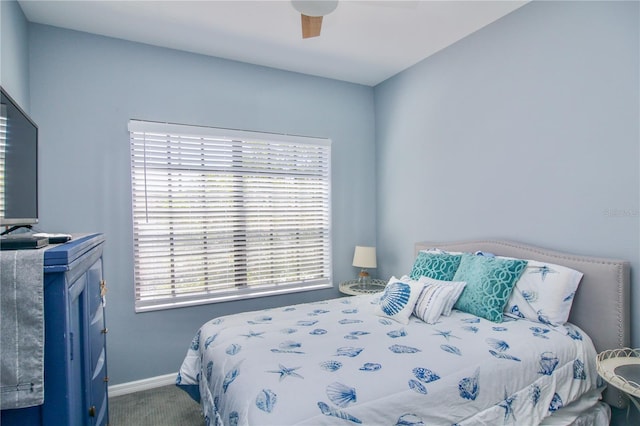 4026 Overture Cir Unit 487, Bradenton, FL 34209 - carpeted bedroom with baseboards and a ceiling fan