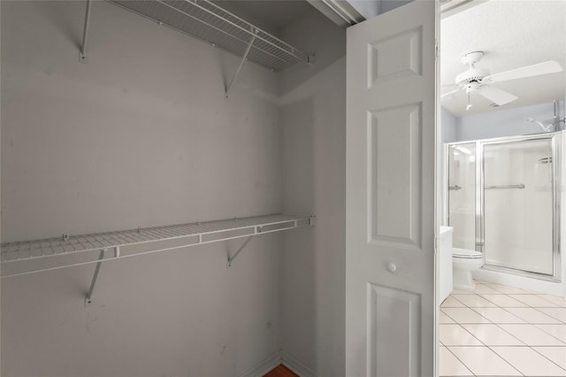2417 Fairway Oaks Dr Unit 22, Palmetto, FL 34221 - walk in closet with a ceiling fan and light tile patterned floors