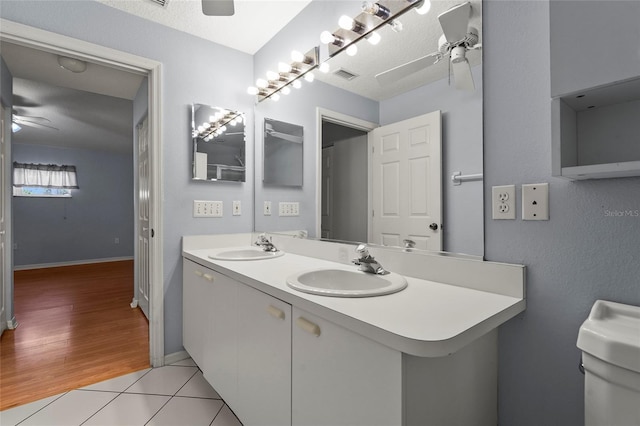 2417 Fairway Oaks Dr Unit 22, Palmetto, FL 34221 - bathroom with a ceiling fan, double vanity, and tile patterned floors