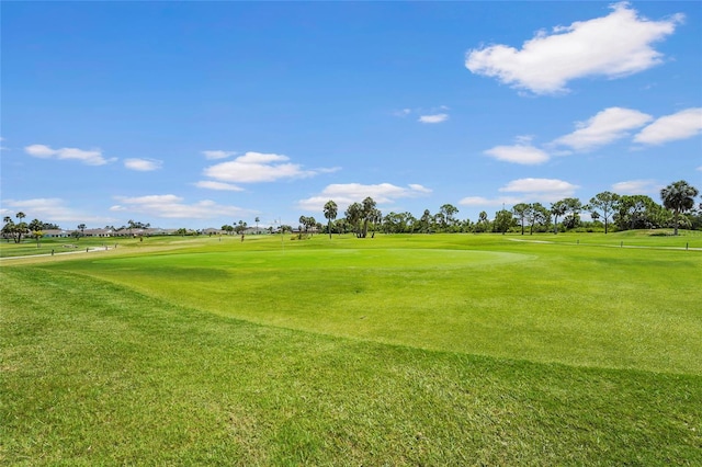 2417 Fairway Oaks Dr Unit 22, Palmetto, FL 34221 - surrounding community with golf course view and a yard