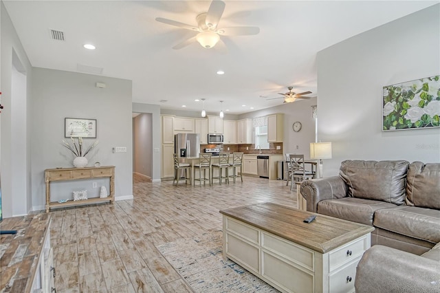 11625 Renaissance Blvd, Venice, FL 34293 - living room with ceiling fan, light wood-style flooring, and recessed lighting