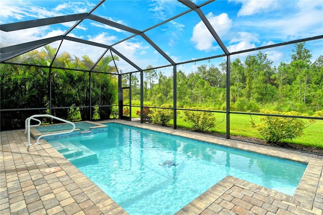 11625 Renaissance Blvd, Venice, FL 34293 - view of swimming pool with a pool with connected hot tub, a patio, and glass enclosure