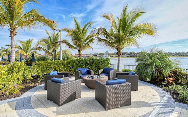 11625 Renaissance Blvd, Venice, FL 34293 - view of patio / terrace with a fire pit and a water view