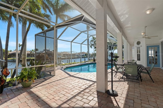 2817 SW 29th Ave, Cape Coral, FL 33991 - swimming pool with a patio, a lanai, a ceiling fan, french doors, and a water view