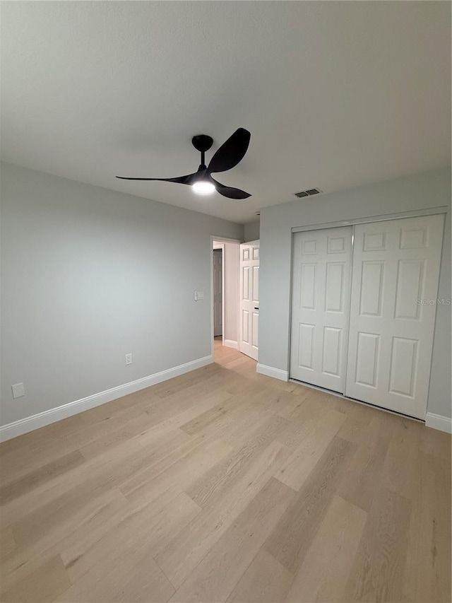 4661 Linwood St, Sarasota, FL 34232 - unfurnished bedroom with light wood-style floors, a closet, and a ceiling fan