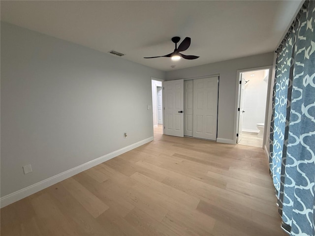 4661 Linwood St, Sarasota, FL 34232 - unfurnished bedroom featuring light wood-style floors, ensuite bathroom, a closet, and ceiling fan