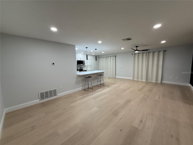 4661 Linwood St, Sarasota, FL 34232 - living room with recessed lighting, light wood-style floors, and ceiling fan