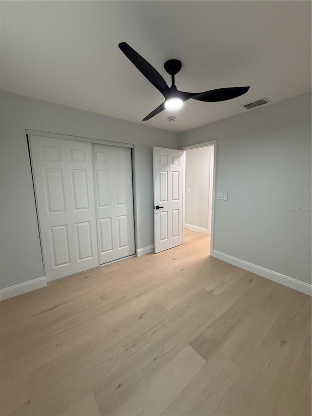 4661 Linwood St, Sarasota, FL 34232 - unfurnished bedroom featuring light wood-style floors, a closet, and a ceiling fan