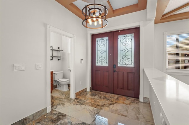 5714 38th Ave E, Bradenton, FL 34208 - entrance foyer with a chandelier and marble finish floors