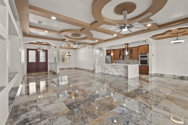 5714 38th Ave E, Bradenton, FL 34208 - entryway with arched walkways, ceiling fan, coffered ceiling, and light marble finish floors