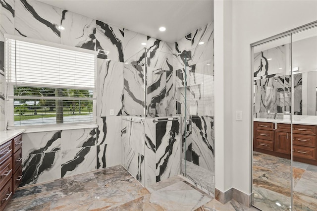 5714 38th Ave E, Bradenton, FL 34208 - bathroom with vanity, a marble finish shower, marble tiled floors, and recessed lighting