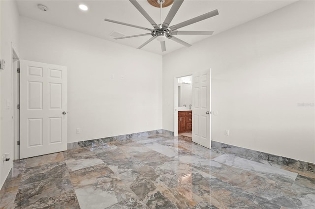 5714 38th Ave E, Bradenton, FL 34208 - unfurnished bedroom with light marble finish flooring, recessed lighting, connected bathroom, and a ceiling fan
