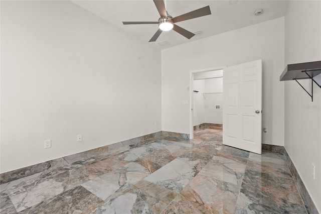 5714 38th Ave E, Bradenton, FL 34208 - empty room featuring a ceiling fan, marble tiled flooring, and a smoke detector