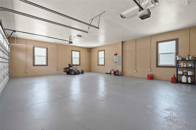 5714 38th Ave E, Bradenton, FL 34208 - garage featuring a garage door opener and electric panel