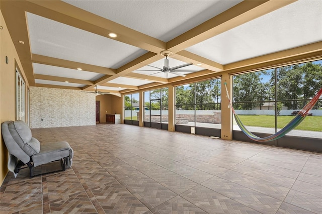 5714 38th Ave E, Bradenton, FL 34208 - unfurnished sunroom featuring coffered ceiling, plenty of natural light, beam ceiling, and arched walkways