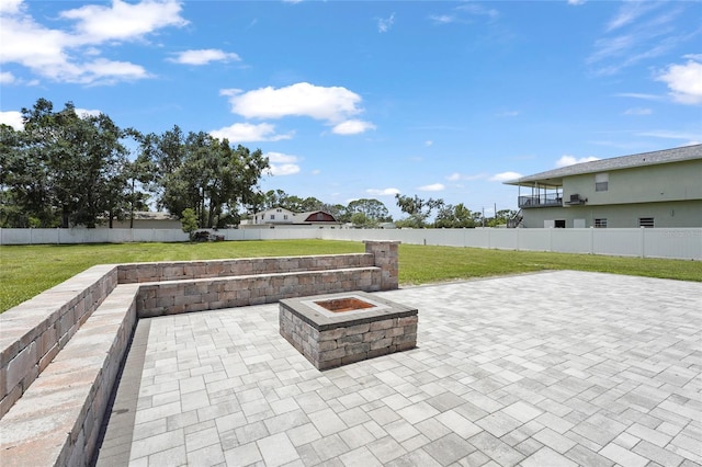 5714 38th Ave E, Bradenton, FL 34208 - fenced backyard featuring an outdoor fire pit and a patio area