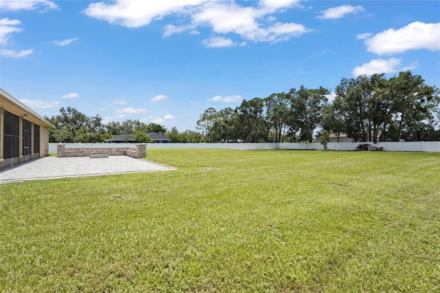 5714 38th Ave E, Bradenton, FL 34208 - view of yard with a patio and a sunroom