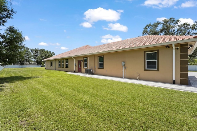 5714 38th Ave E, Bradenton, FL 34208 - rear view of house with a tiled roof and stucco siding