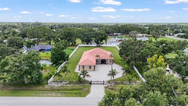 5714 38th Ave E, Bradenton, FL 34208 - aerial view of property and surrounding area with a tree filled landscape