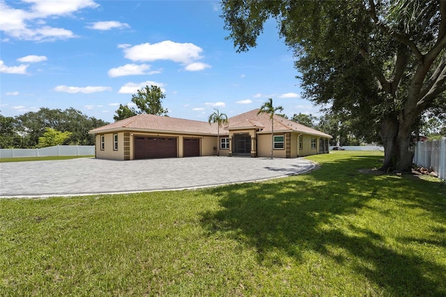 5714 38th Ave E, Bradenton, FL 34208 - view of front of house with an attached garage, driveway, and stucco siding