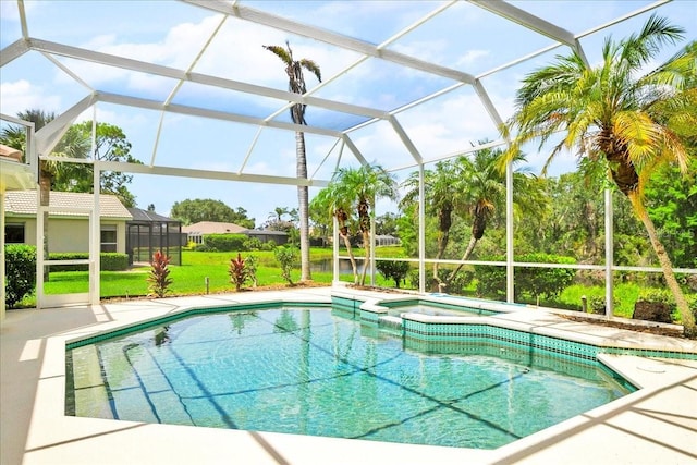 4724 White Tail Ln, Sarasota, FL 34238 - view of pool with a lanai, a lawn, a pool with connected hot tub, and a patio area