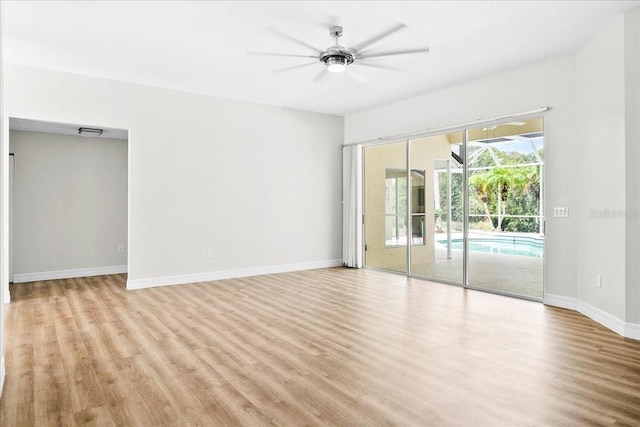 4724 White Tail Ln, Sarasota, FL 34238 - empty room featuring light wood finished floors and ceiling fan