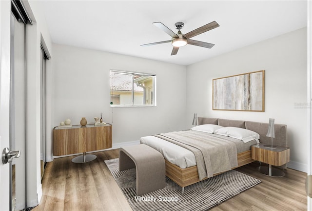 4724 White Tail Ln, Sarasota, FL 34238 - bedroom featuring wood finished floors, a closet, and a ceiling fan