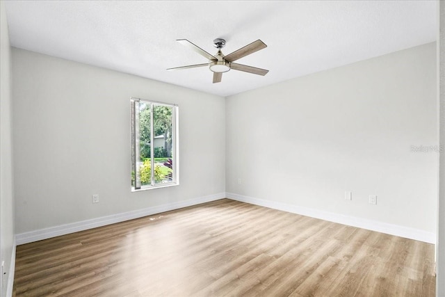 4724 White Tail Ln, Sarasota, FL 34238 - unfurnished room with ceiling fan and wood finished floors
