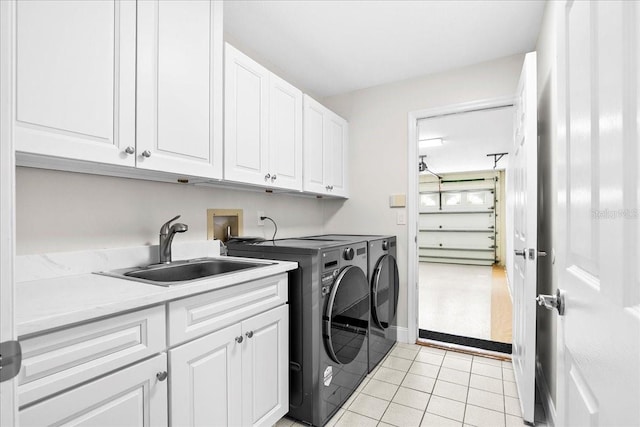 4724 White Tail Ln, Sarasota, FL 34238 - washroom featuring cabinet space, separate washer and dryer, and light tile patterned floors