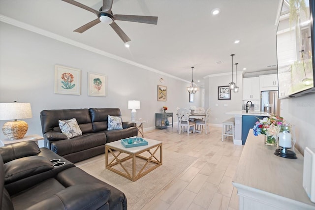 12349 Asana Ct, Venice, FL 34293 - living room featuring a ceiling fan, light wood-style floors, ornamental molding, recessed lighting, and a chandelier
