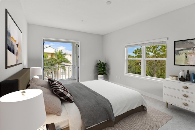 7611 34th Ave W Unit 301, Bradenton, FL 34209 - bedroom featuring access to outside and carpet